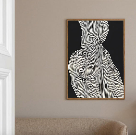Framed abstract art print on a beige wall