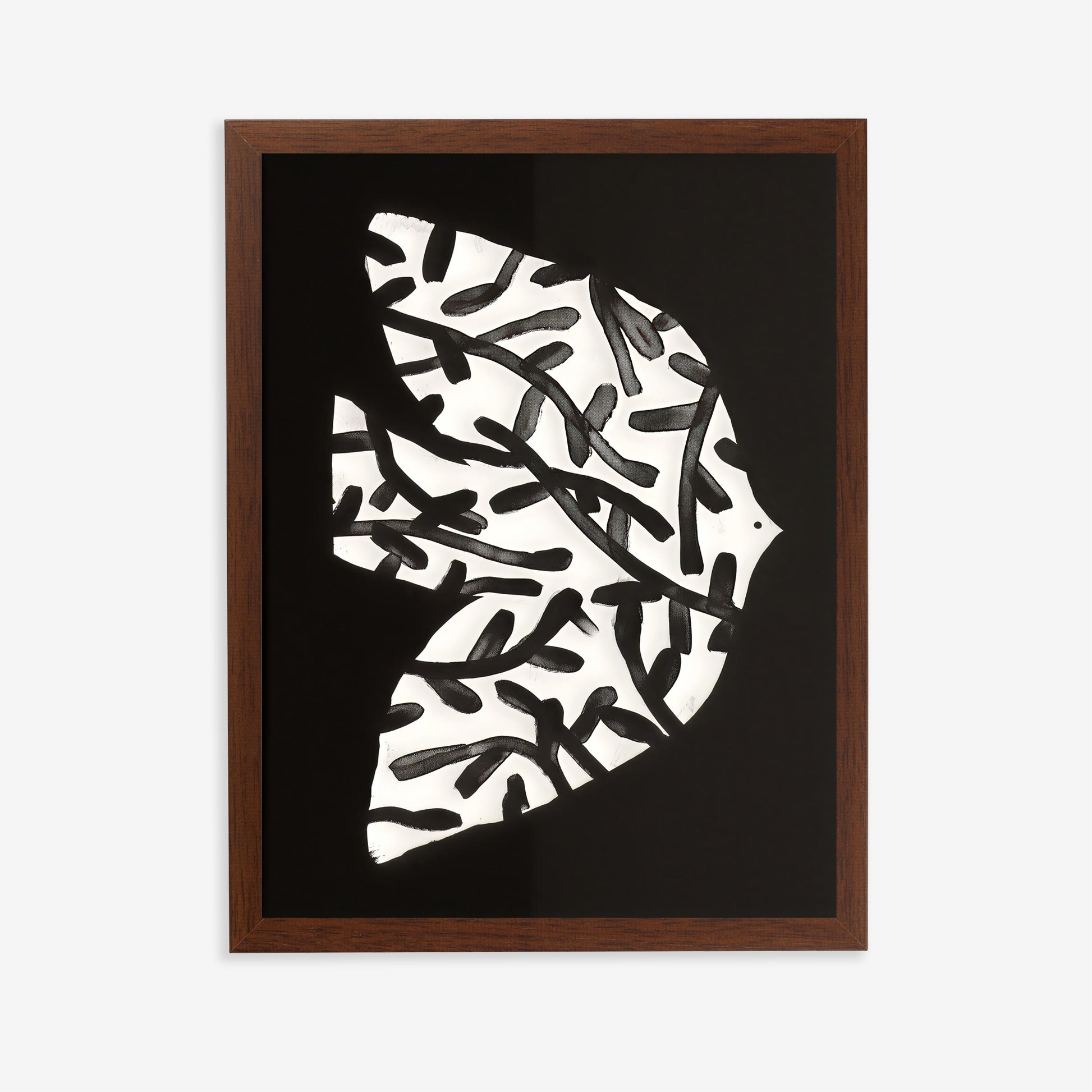 Framed abstract art print with black and white pattern on a dark background