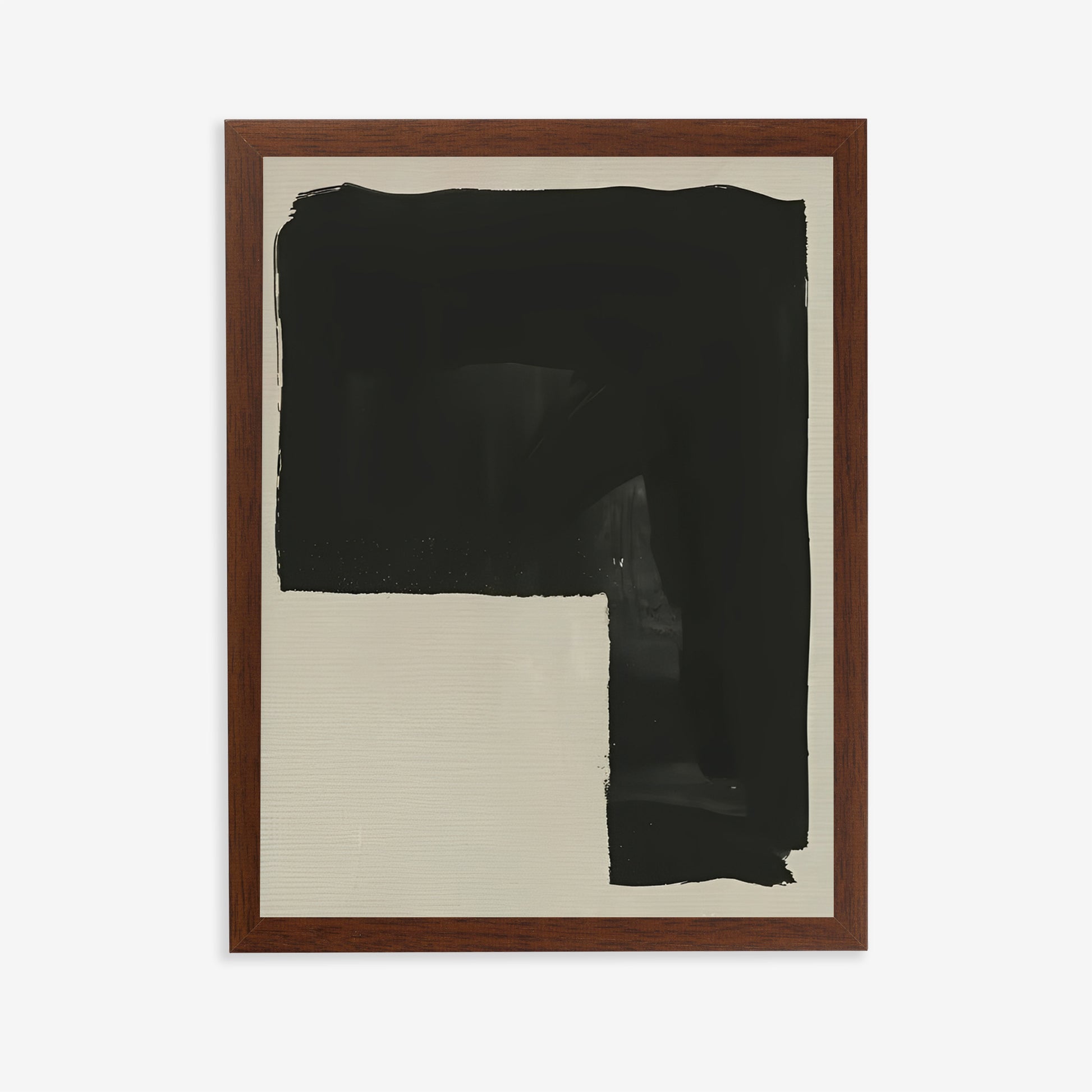 Framed abstract artwork with black paint on a beige background