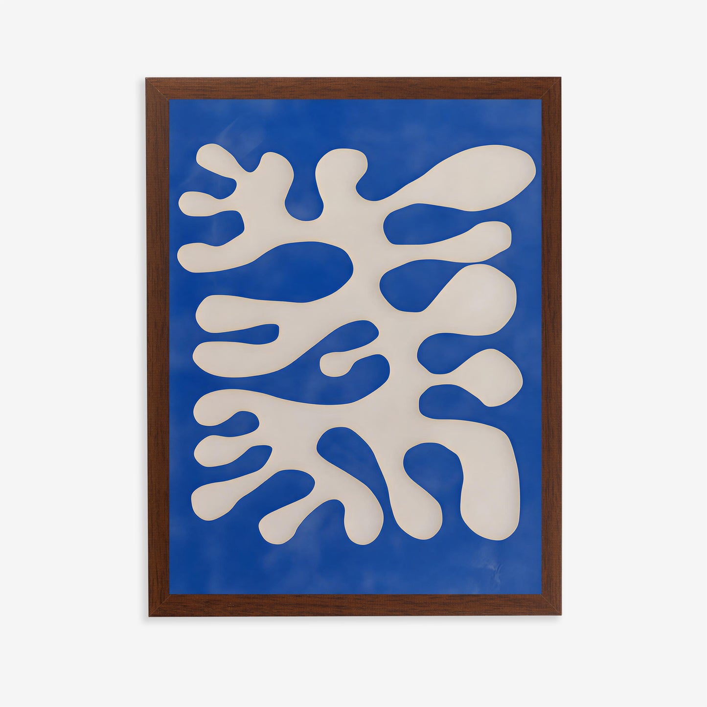 Framed abstract artwork with white and blue shapes on a blue background