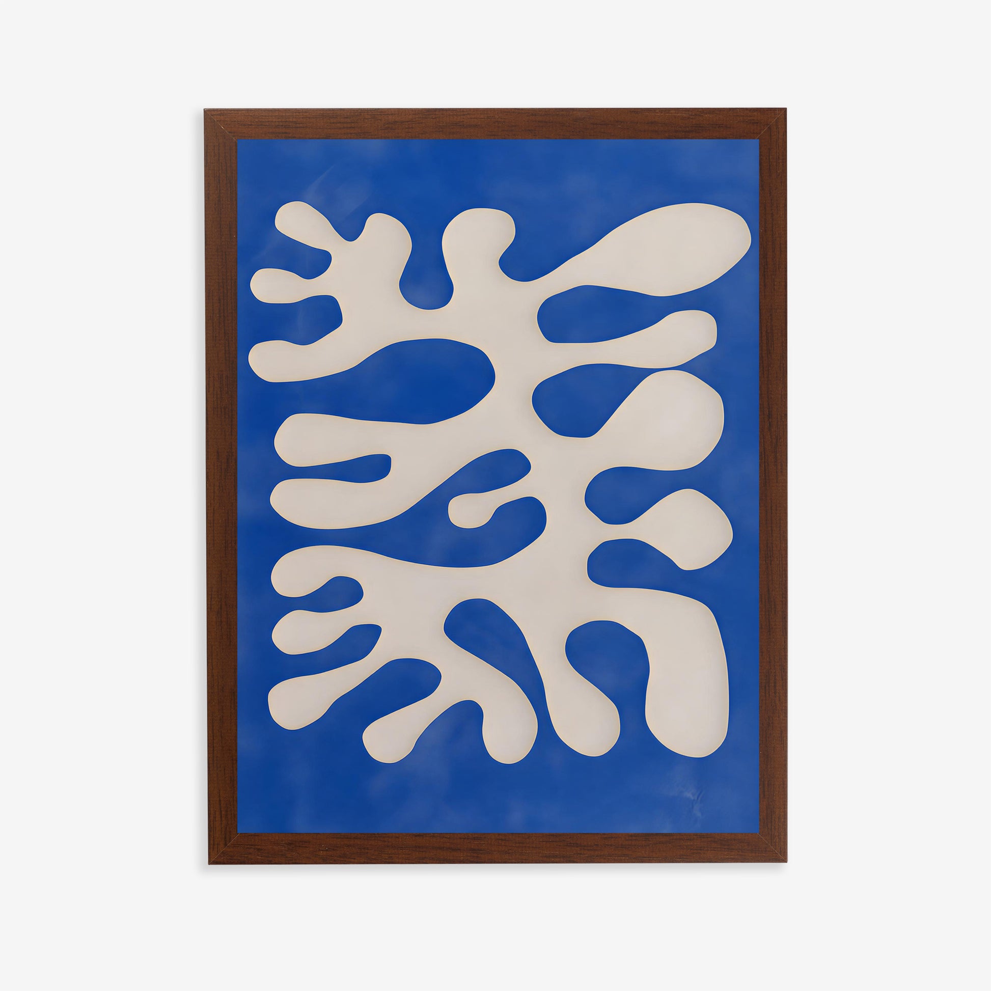 Framed abstract artwork with white and blue shapes on a blue background