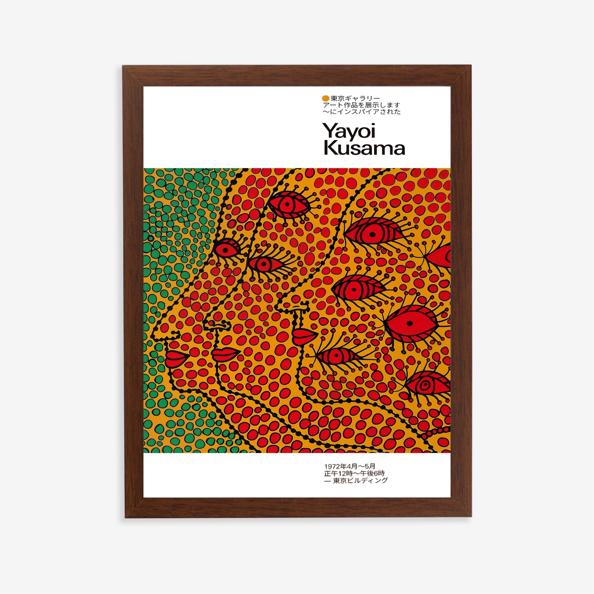 Yayoi Kusama art poster with dotted abstract faces and red eyes in a dark wood frame