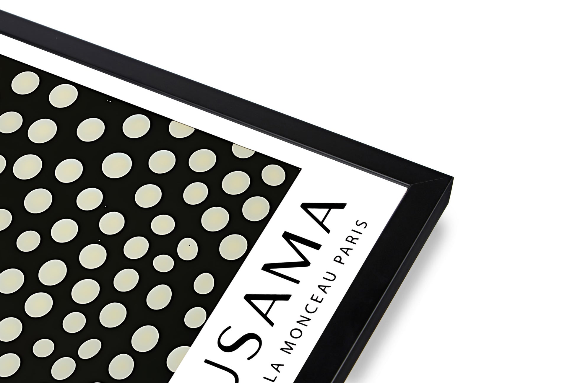 Close-up of black frame corner on Yayoi Kusama art print – premium framed wall art detail