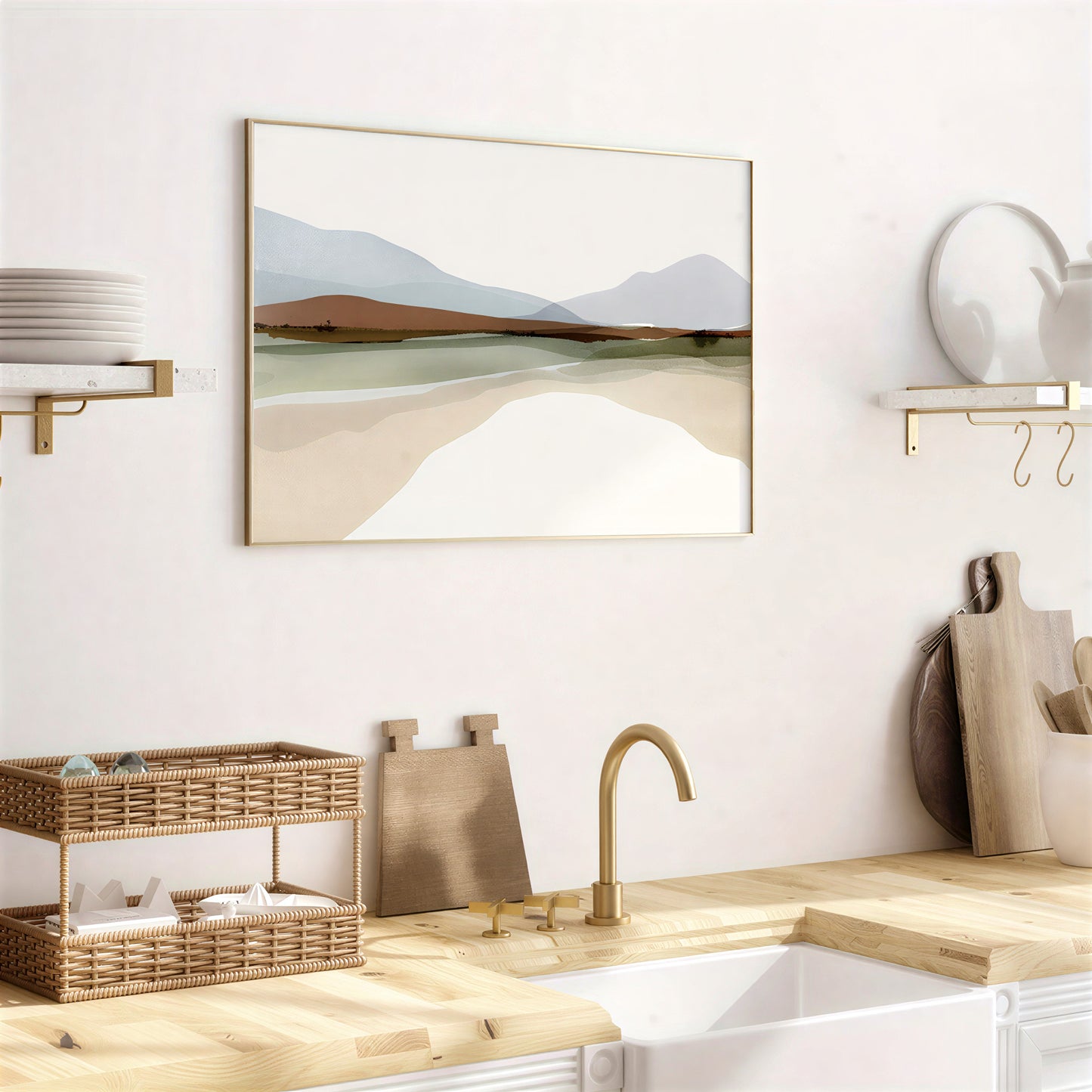 Modern kitchen with a framed landscape print on the wall, wooden countertops, and gold fixtures.