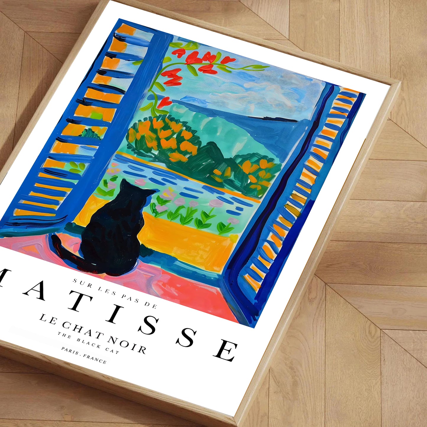 Framed Matisse print of a cat by a window on a wooden floor