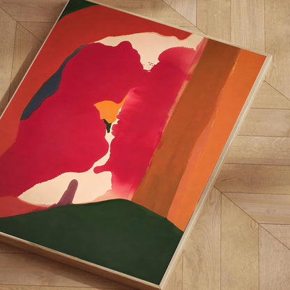 Abstract artwork with red, orange, and green colors on a wooden floor.