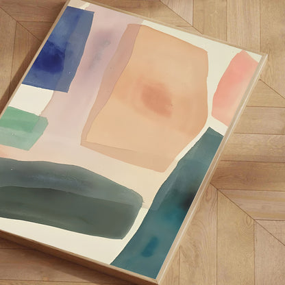 Abstract art piece with colorful geometric shapes on a wooden floor.