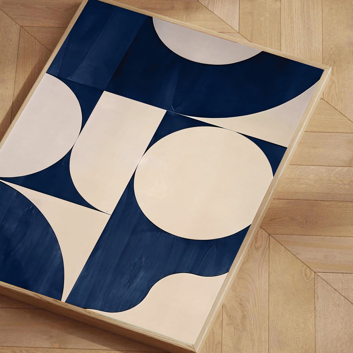 Geometric-patterned rug with blue and beige colors on a wooden floor