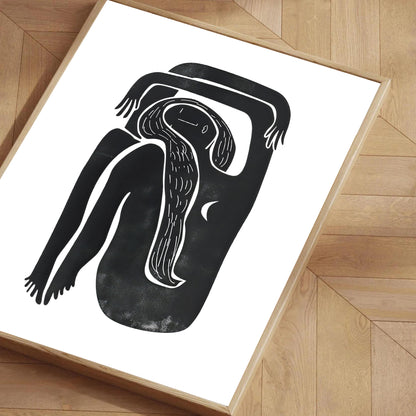Framed artwork of a black and white abstract figure on a white background