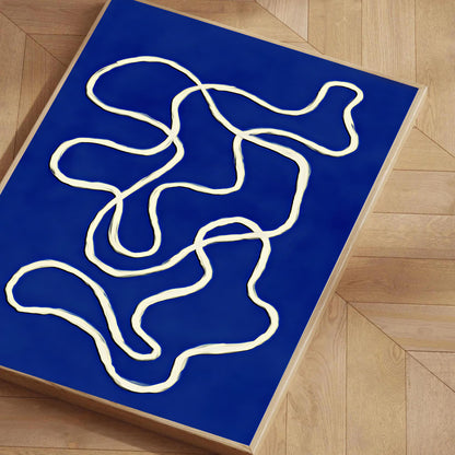 Abstract white line design on a blue mat on a wooden floor