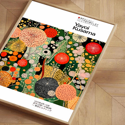 Framed artwork with colorful abstract design and 'Yayoi Kusama' branding on a wooden floor.