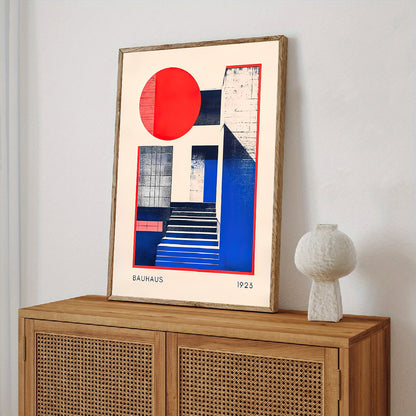 Framed abstract art piece on a wooden cabinet with a white lamp.