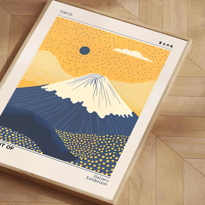 Framed poster of Mount Fuji with a yellow and blue design on a wooden floor.