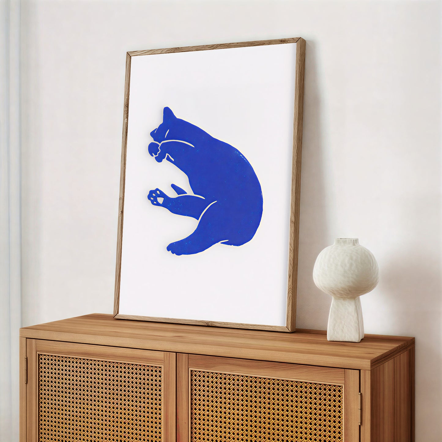 Modern graphic cat illustration framed in black