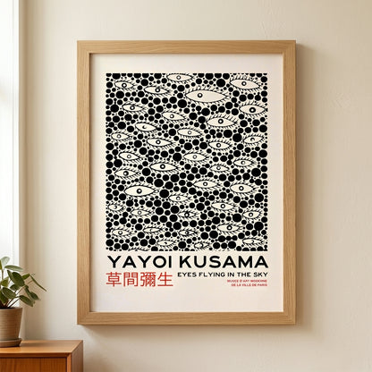 Yayoi-Kusama Inspired Poster Dots and Eyes titled 'Eyes Flying in the Sky' on a wall.