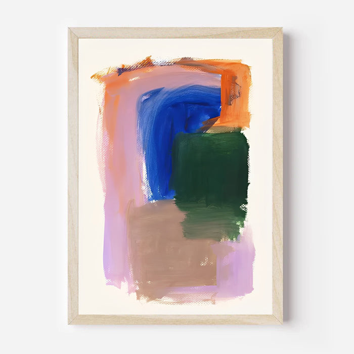 Abstract art print with colorful brush strokes in a wooden frame on a white wall.
