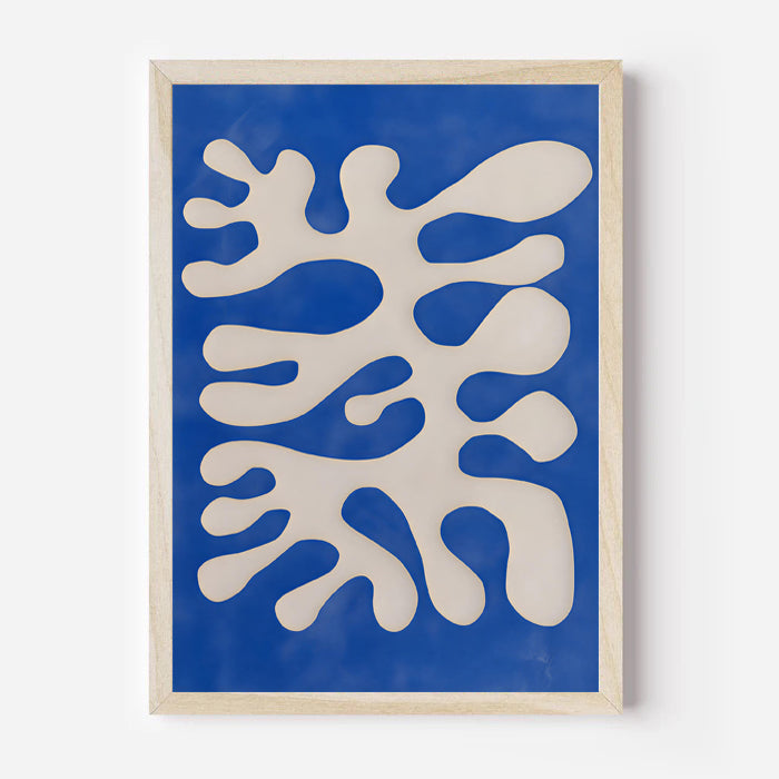 Framed abstract art print with white shapes on a blue background