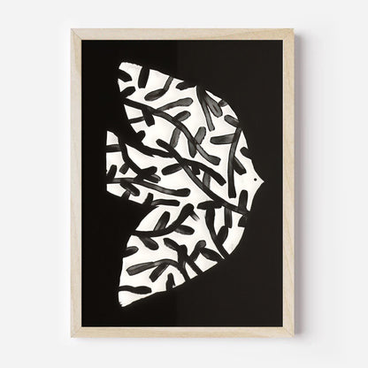 Framed abstract art print with black and white pattern on a black background