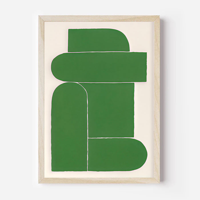 Framed abstract art piece with green shapes on a white background