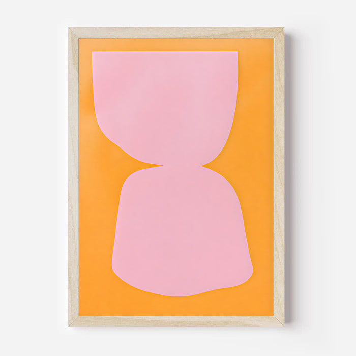 Framed abstract art print with pink shapes on an orange background