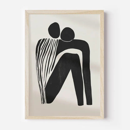 Framed abstract artwork of two black figures on a beige background