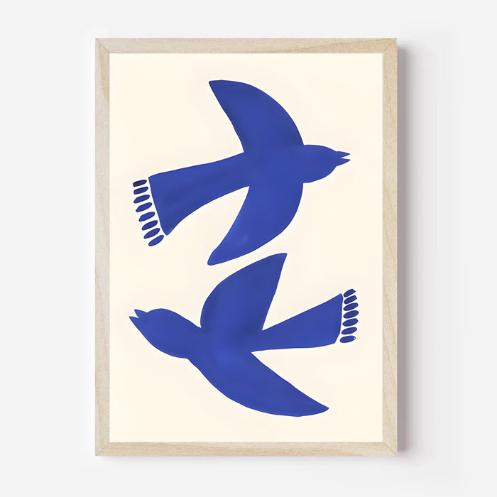 Framed artwork with blue birds on a beige background