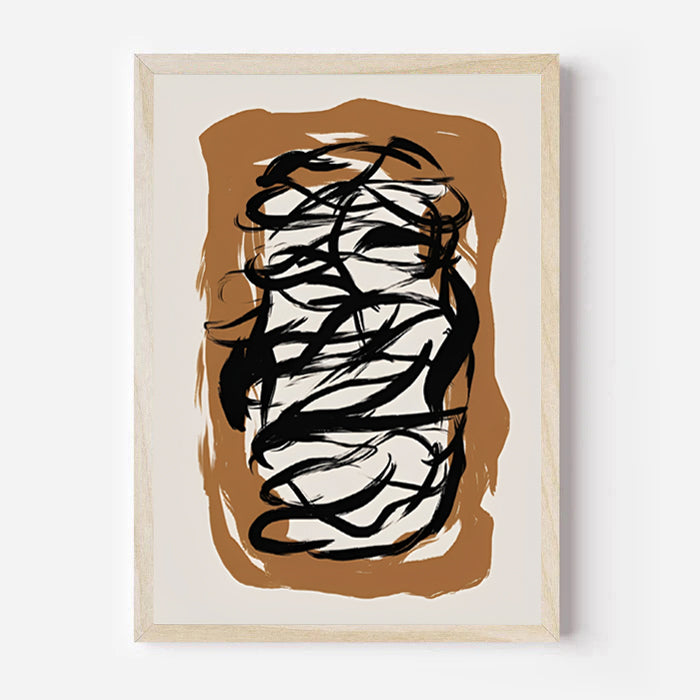 Abstract art print with black brush strokes on a brown and beige background, framed in a light wood color.