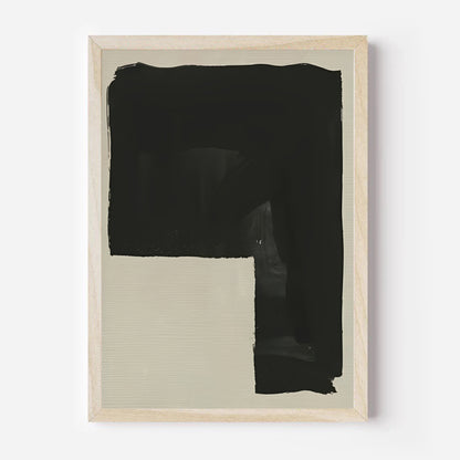 Framed abstract art piece with black and beige sections on a white background