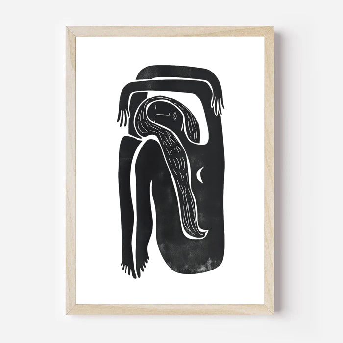 Framed black and white abstract artwork on a white wall