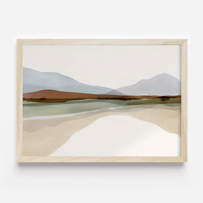 Framed abstract landscape art on a white wall