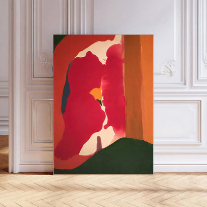 Abstract painting with red, green, and orange colors on a wall.