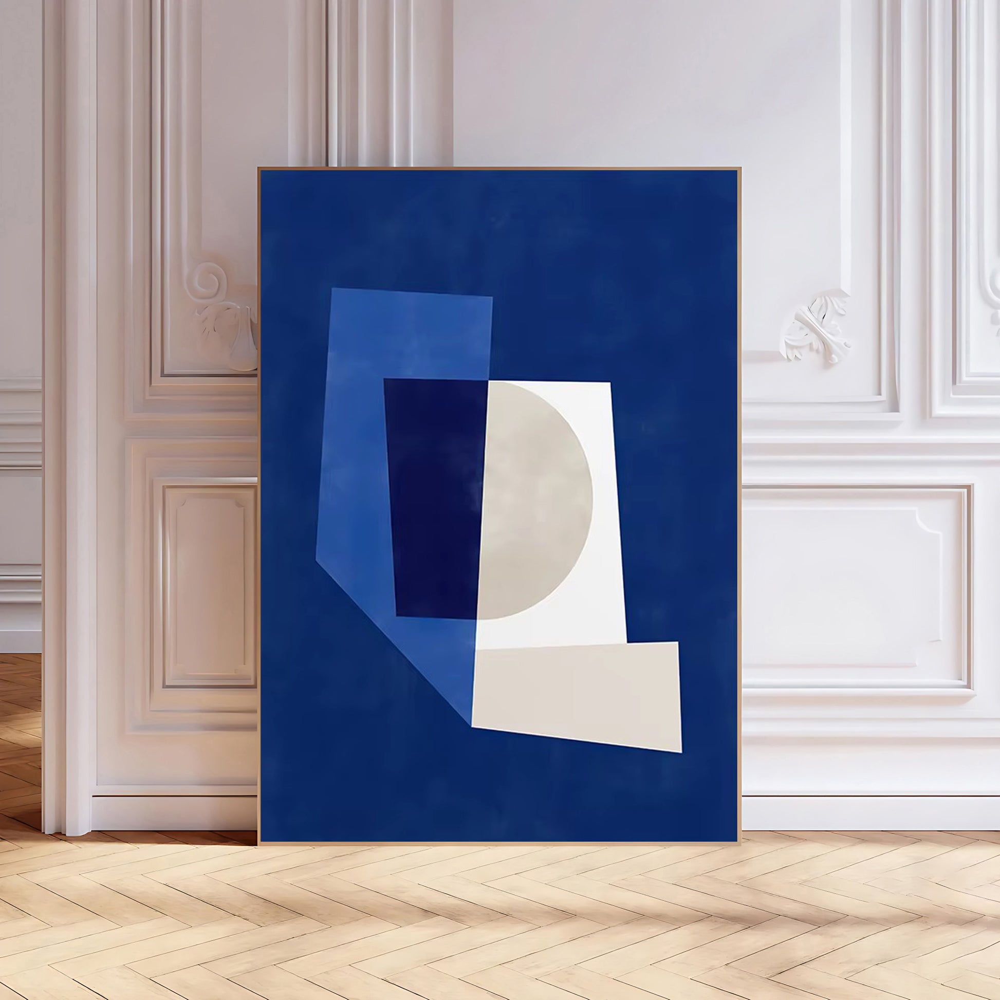 Abstract art print with geometric shapes on a blue background in a room with white walls and wooden floor.