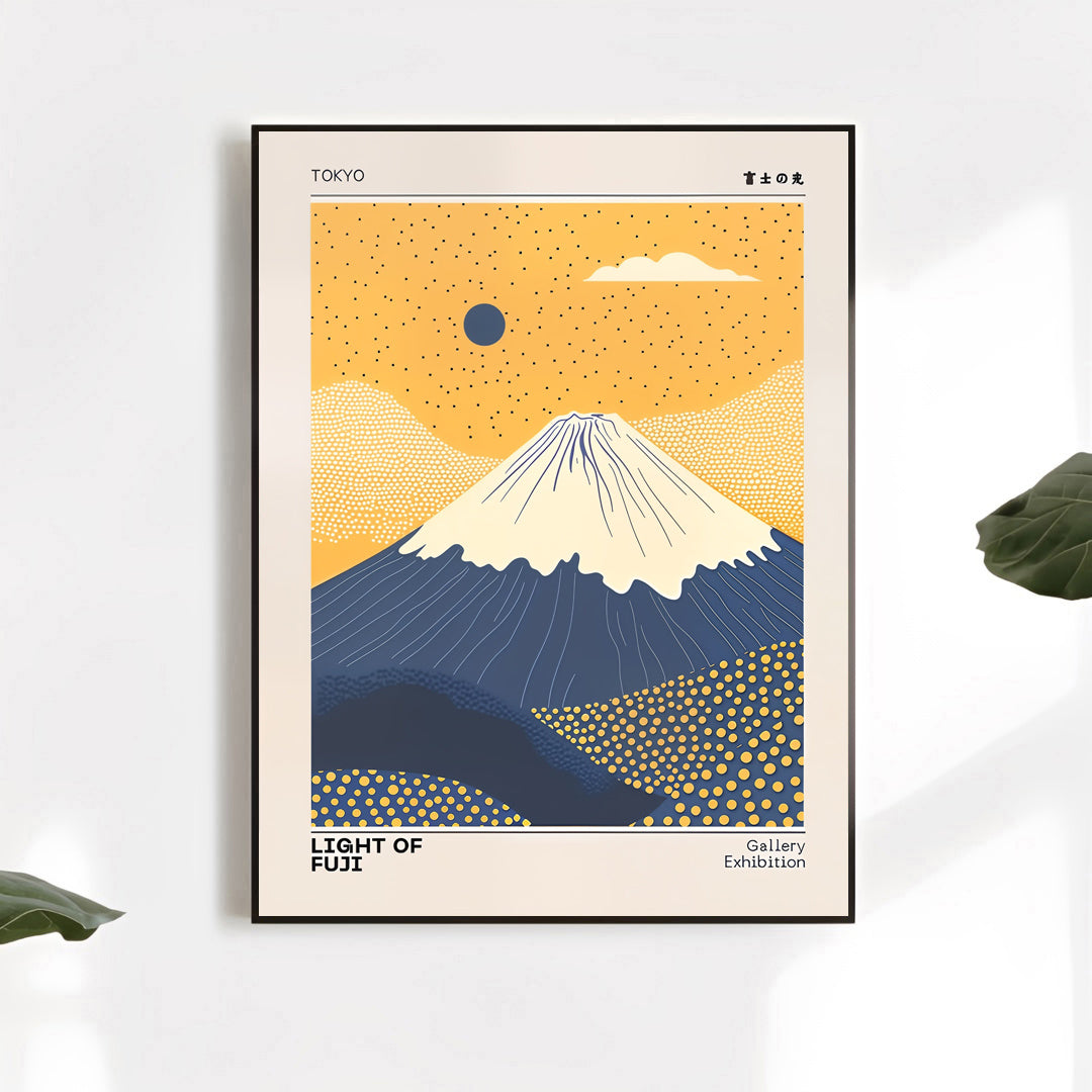 Framed artwork of Mount Fuji with a yellow sky and blue mountains on a white wall.
