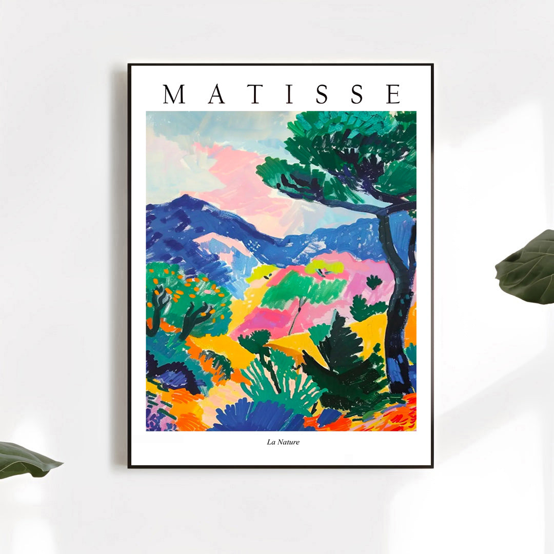 Framed Matisse artwork with colorful landscape on a white wall.