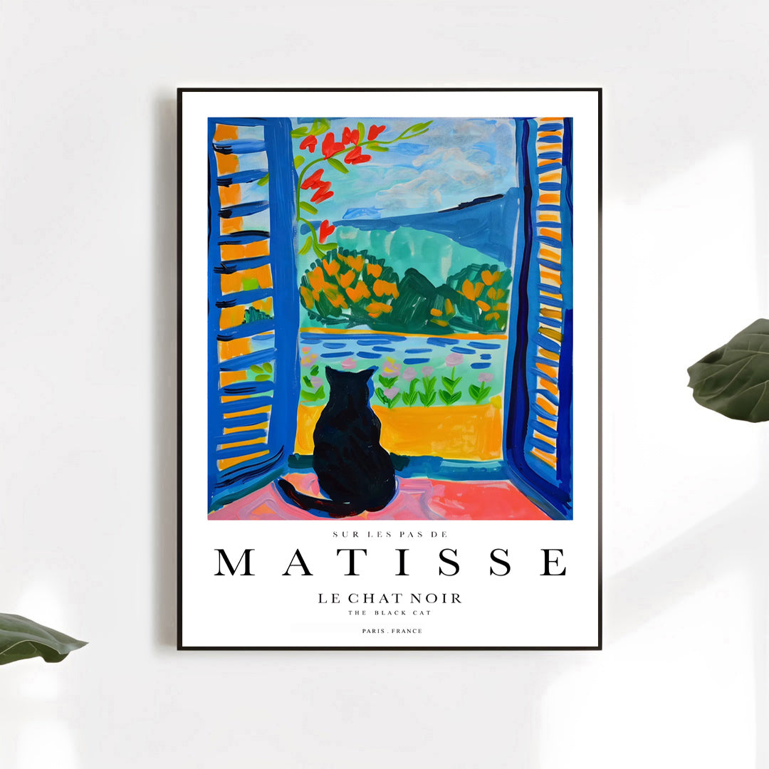 Framed Matisse art print of a black cat by a window with colorful landscape.