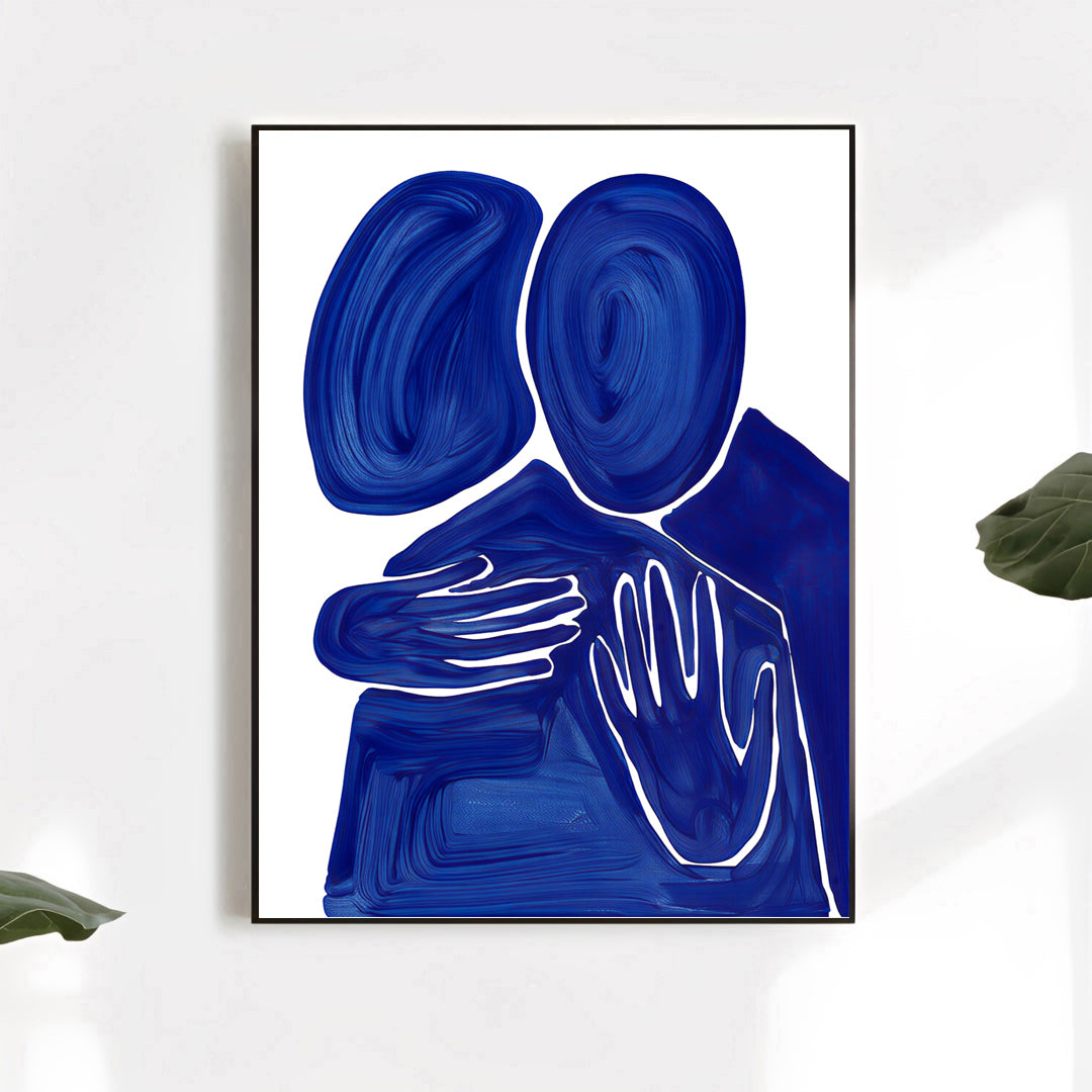 Framed abstract art piece with blue and white design on a white wall.