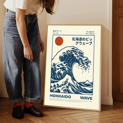 Person standing next to a framed poster of a Hokusai Wave Poster Print