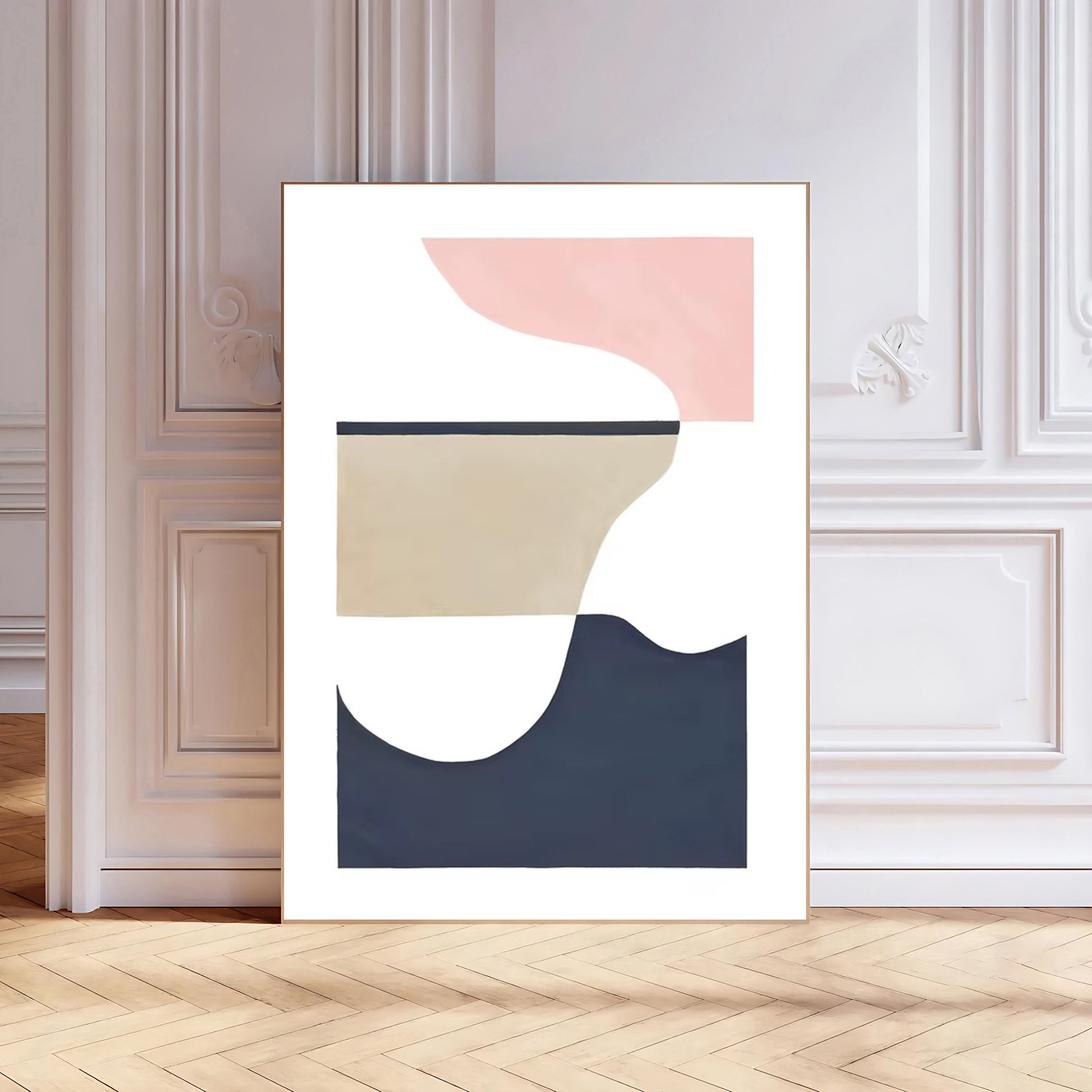 Abstract art print with geometric shapes in pink, beige, and navy on a white background, framed and displayed in a room.