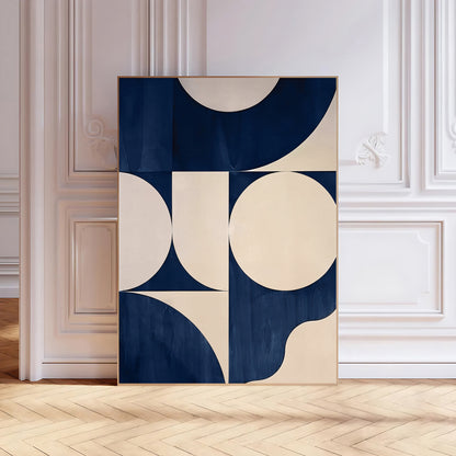 Abstract art print with geometric shapes in blue and beige on a white wall.