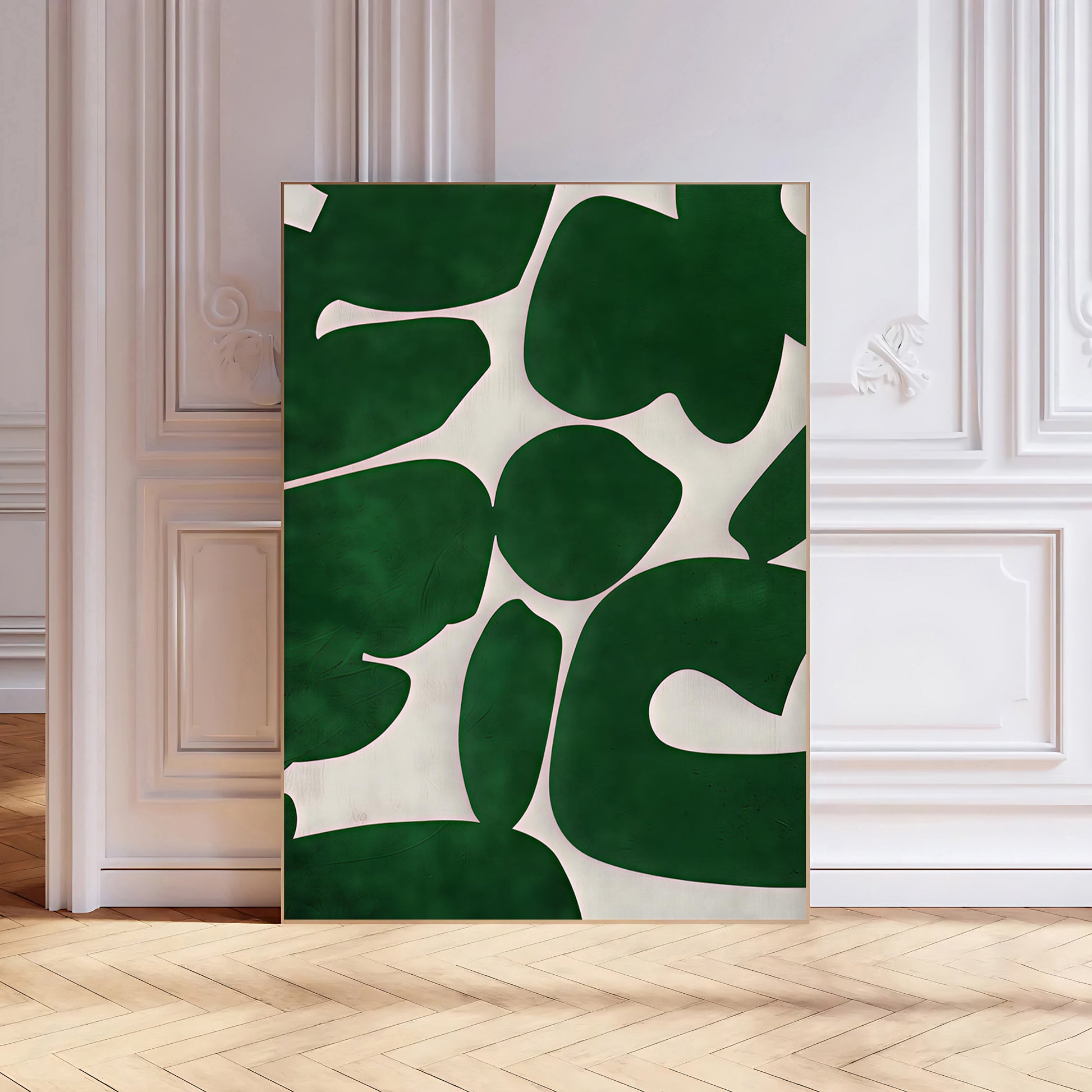 Decorative wall art with green and white abstract design on a wooden floor.