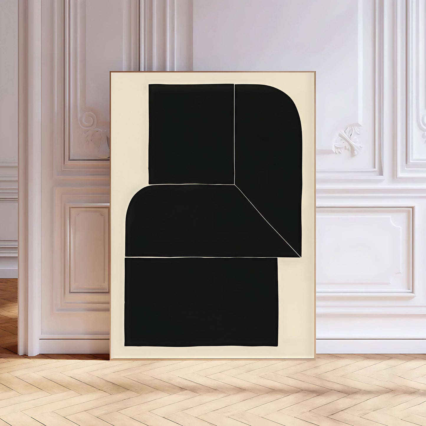Abstract art piece with black and beige shapes on a wall in an elegant room.