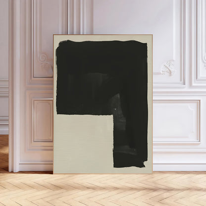 Abstract art piece with a large black square on a light background in a room with wooden flooring and white walls.