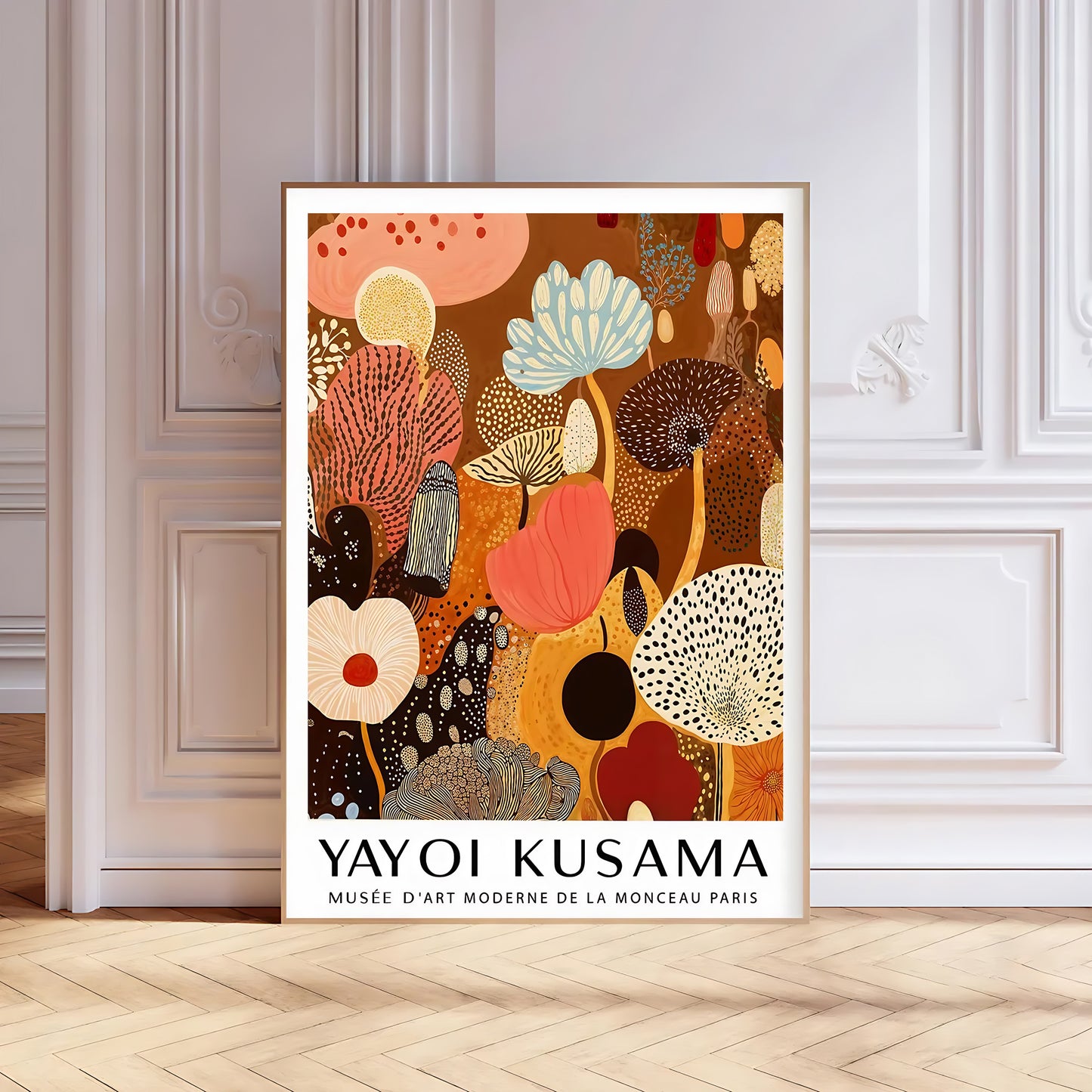 Framed Yayoi Kusama artwork on a wall with decorative molding.