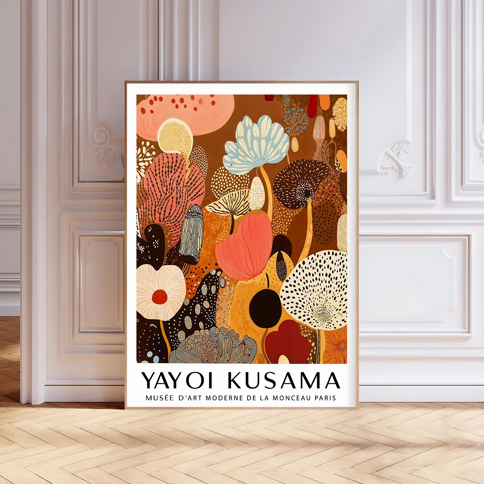 Framed Yayoi Kusama artwork on a wall with decorative molding.