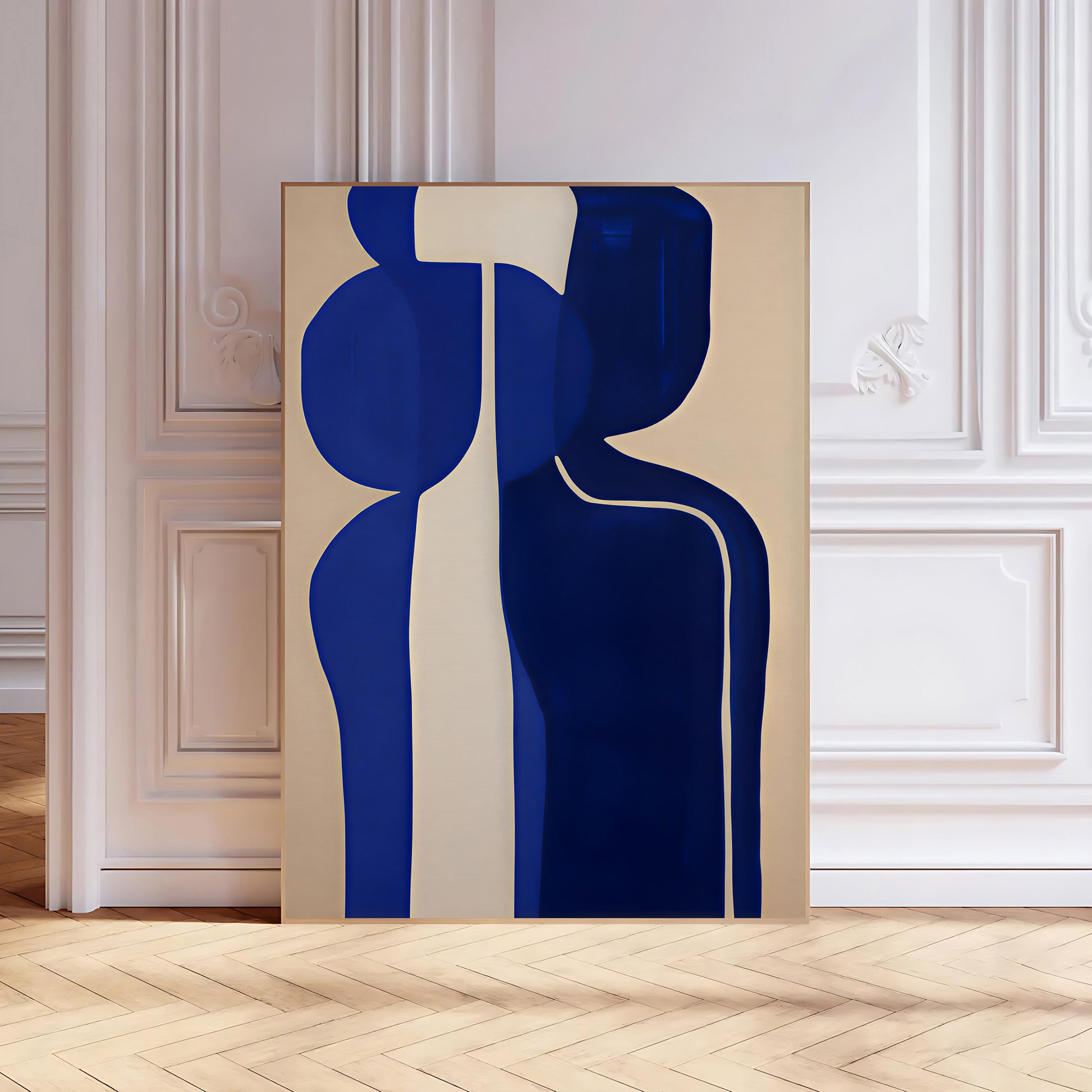 Abstract art piece with blue and beige shapes on a wall in a room with wooden floor and white walls.