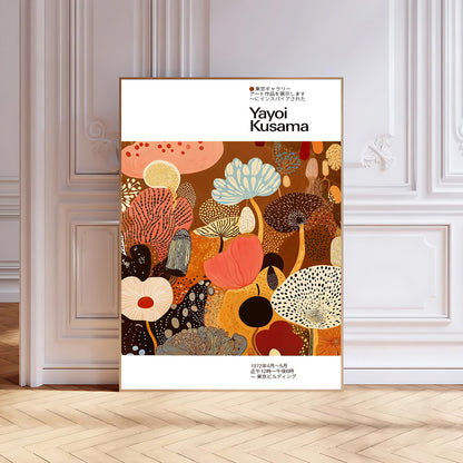 Framed artwork with colorful abstract design and 'Yayoi Kusama' branding on a white wall.