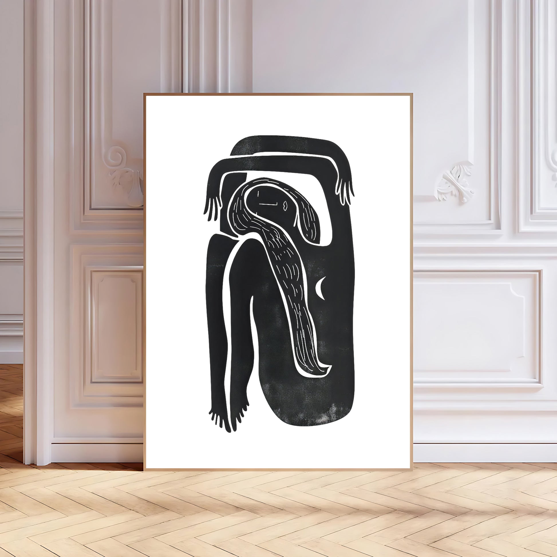 Framed black and white abstract artwork on a wall with wooden flooring.