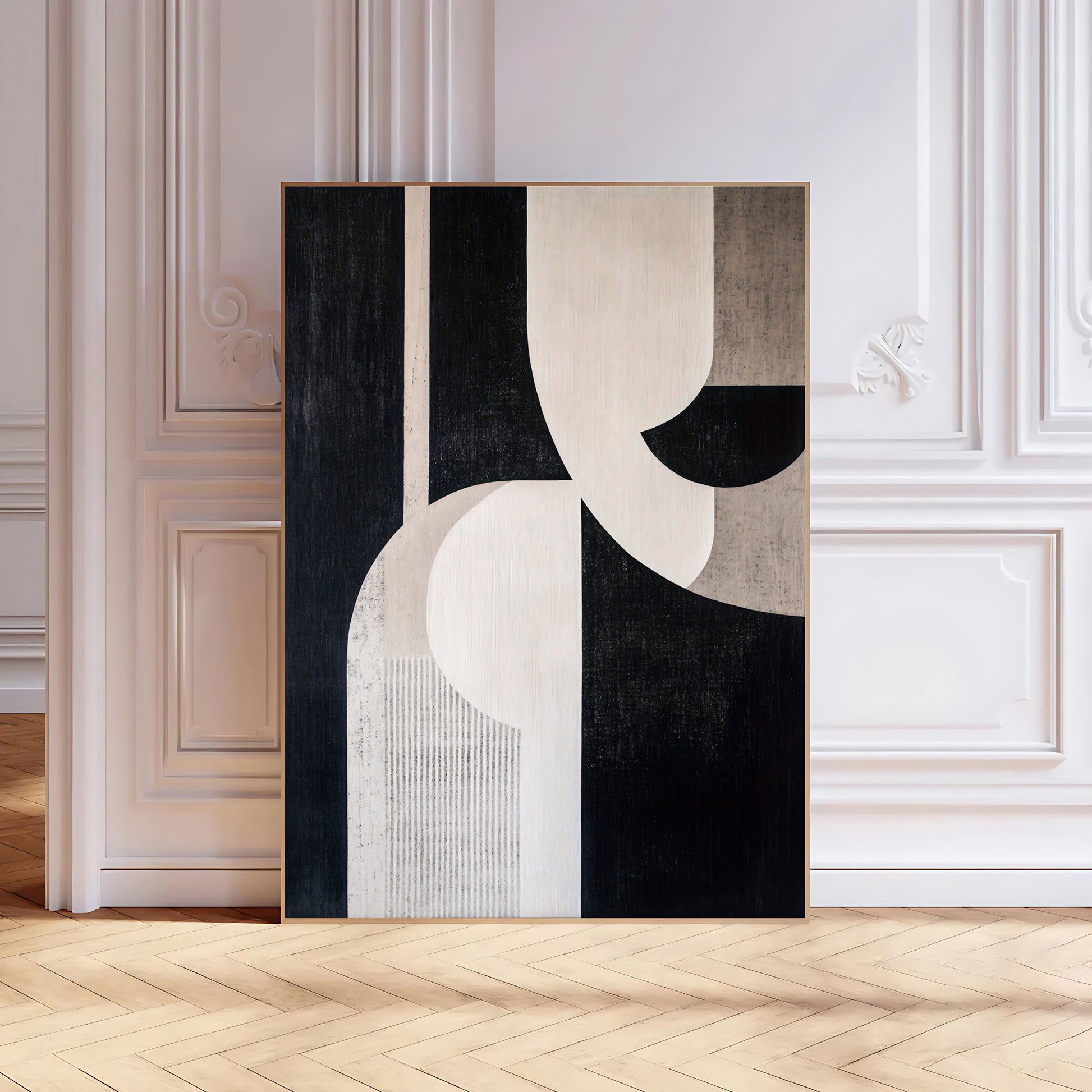 Abstract art piece on a wall in a room with wooden flooring and white walls.