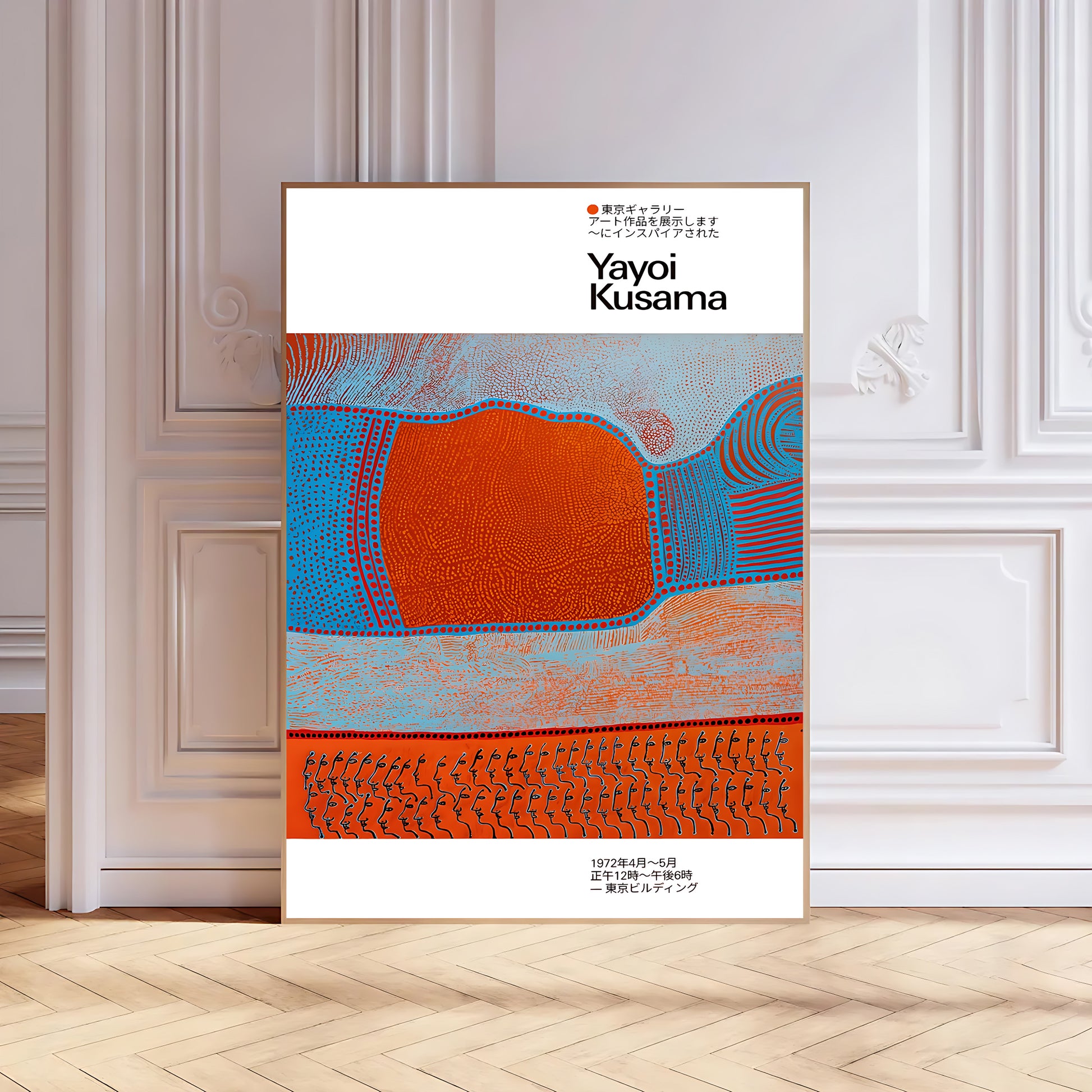 Framed artwork by Yayoi Kusama on a wall with decorative molding.