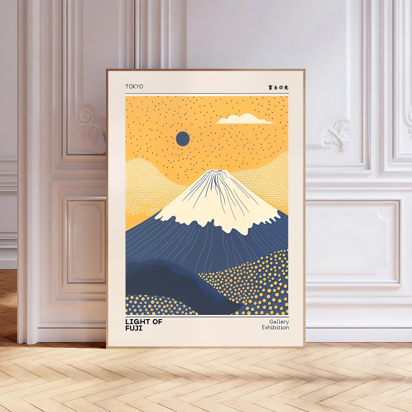 Framed artwork of Mount Fuji with a yellow sky and blue mountain, displayed on a wall.